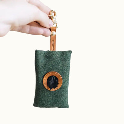 Green keychain pouch with Faux leather patch held by a hand on a white background